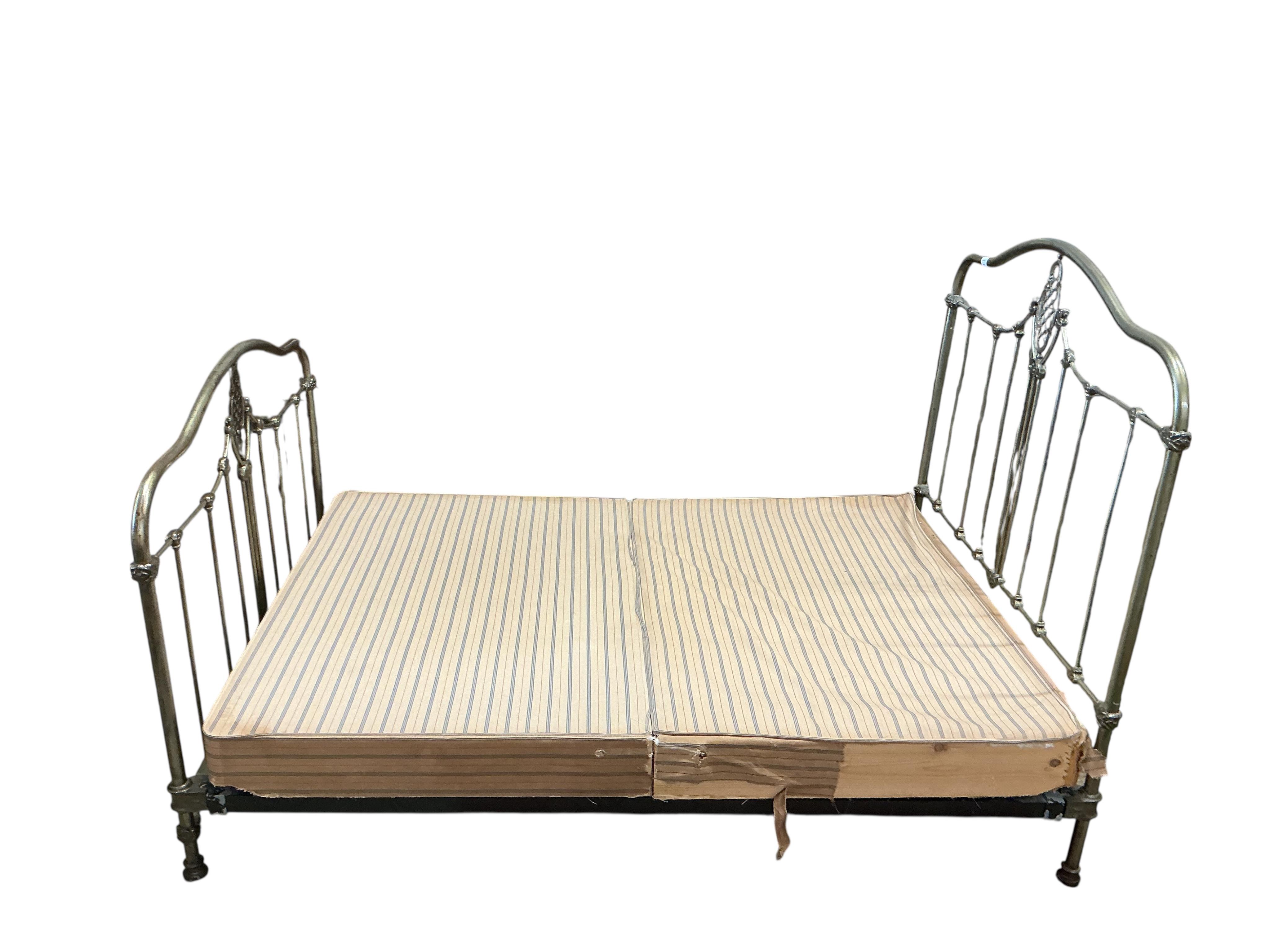 A Victorian style metal bedframe, width 138cm, length 202cm, height 136cm